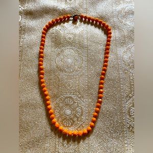 Vintage orange glass bead necklace.